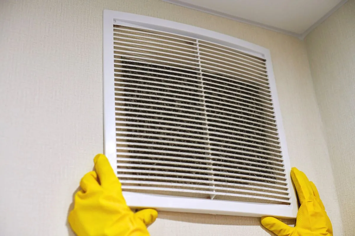 holding ventilation grill of hvac for cleaning