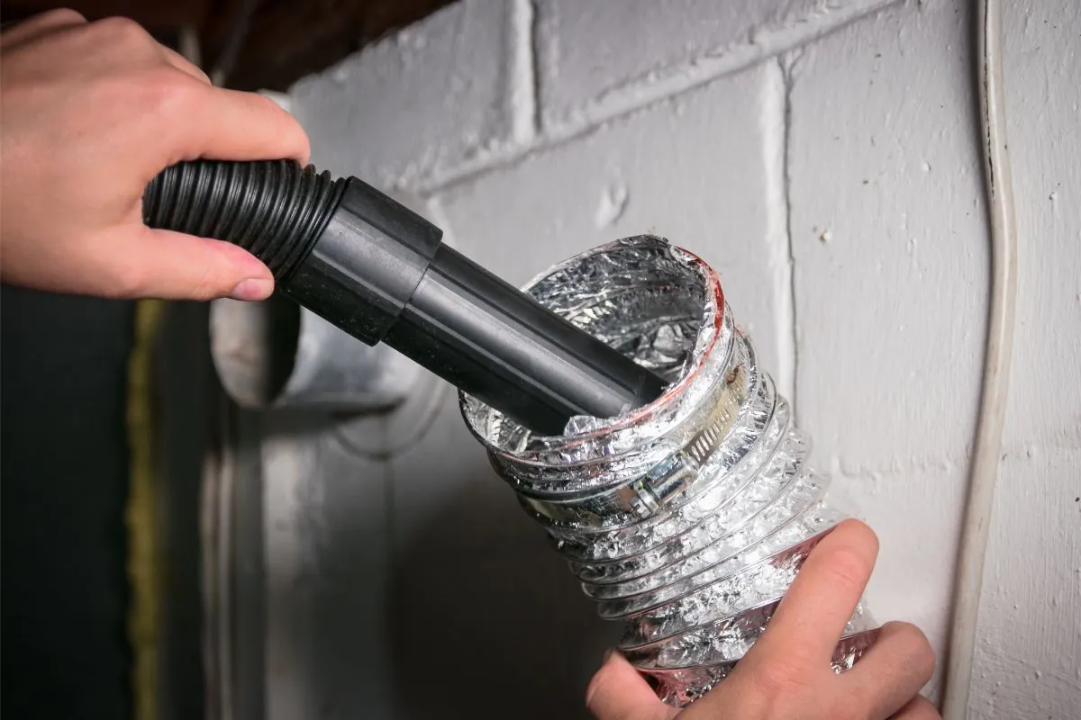 vacuum cleaning a flexible aluminum dryer vent hose