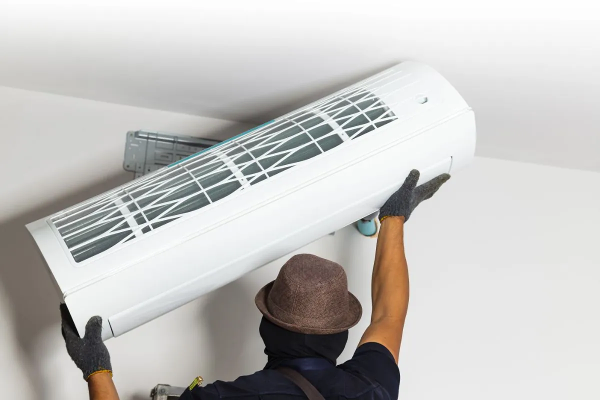 air condition technician replace new air conditioner on the wall at home in Albuquerque NM