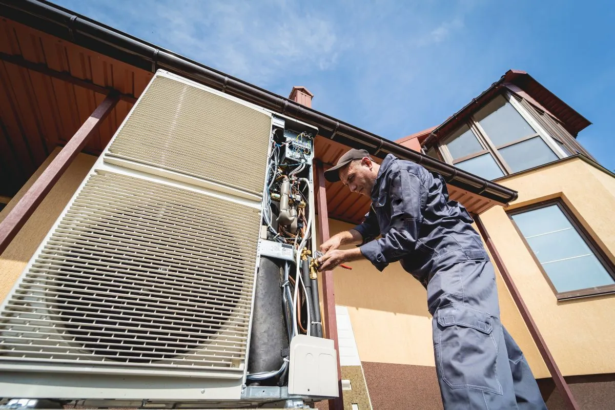 hvac technician servicing home heating and cooling system in Albuquerque NM